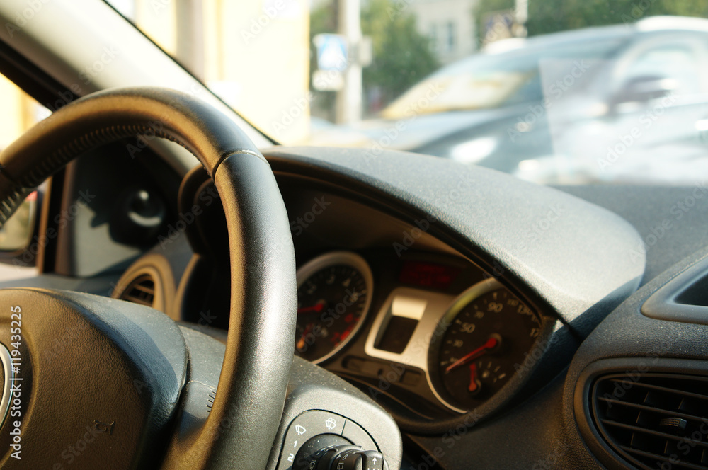 Close up of steering wheel commands in modern car