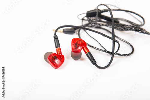 Sporting earphones for sport trainings with fixing behind an ear