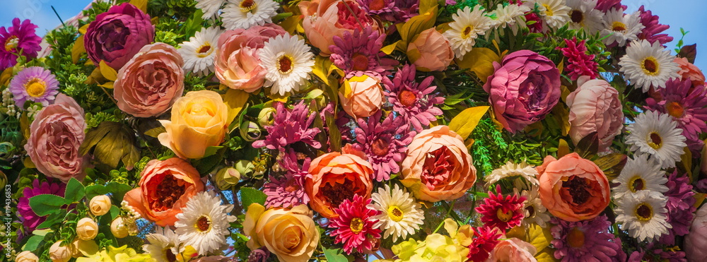 Decorative flower arrangement of roses, lilies and other flowers