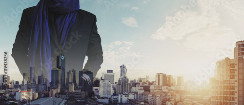 Businessman hand in pocket with multiple exposure cityscape view in sunrise background