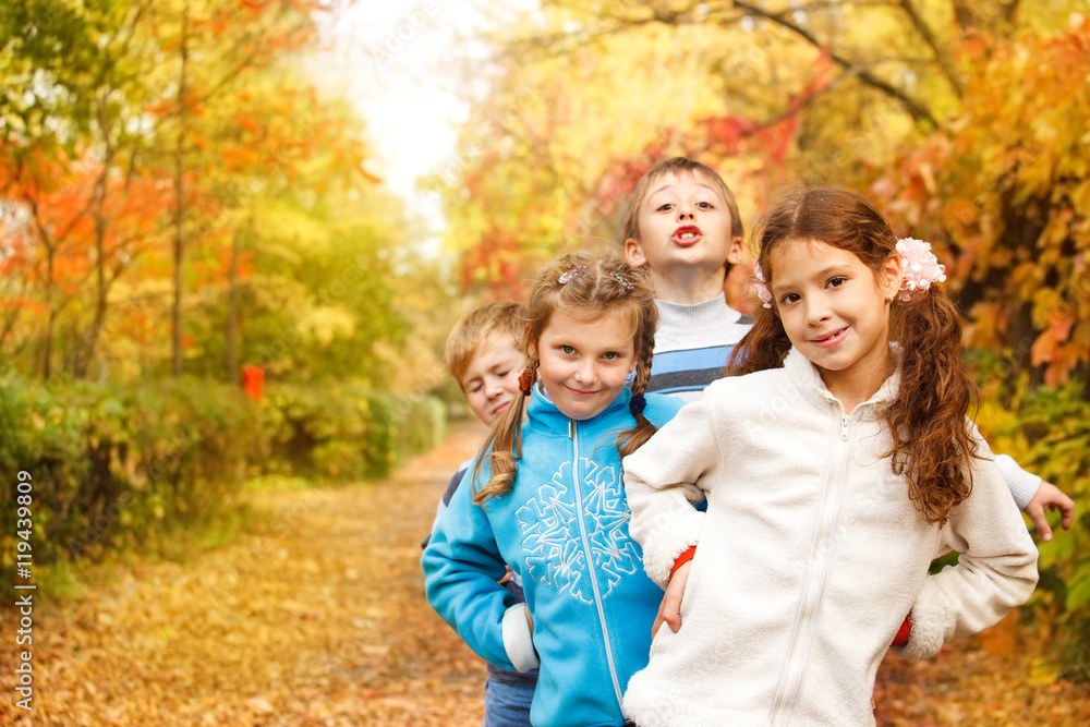 Kids playing in an autumn park Kids playing in an autumn park