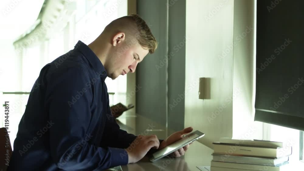 Young man using tablet Young man using tablet