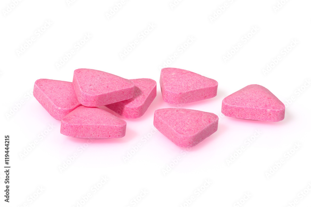 Pink pills triangle shape close up macro photography drug on white background Pink pills triangle shape close up macro photography drug on white background