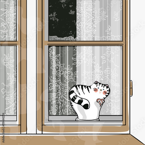 statuette of a cat on window sill