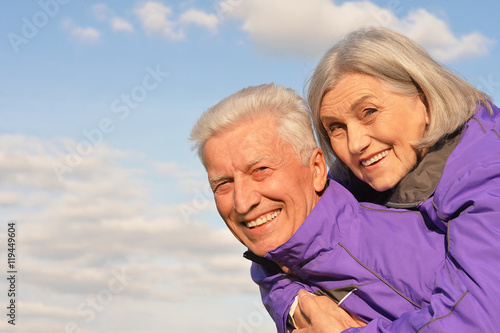 elderly couple on the background of sky