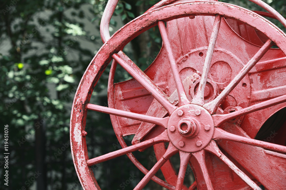 Red reel on vintage fire engine, closeup photo