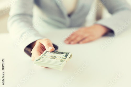 close up of woman hands holding us dollar money