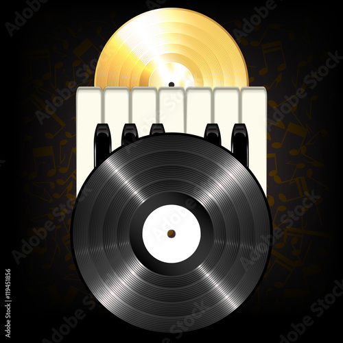 Gold and black classic vinyl record and piano keys on a dark background with music notes.