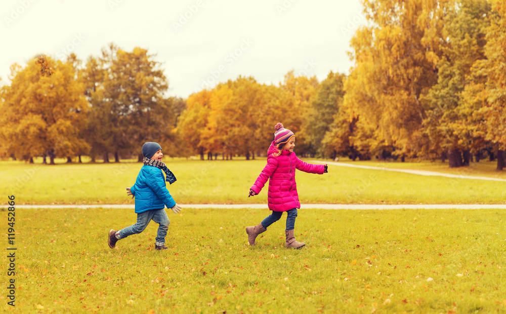 group of happy little kids running outdoors group of happy little kids running outdoors