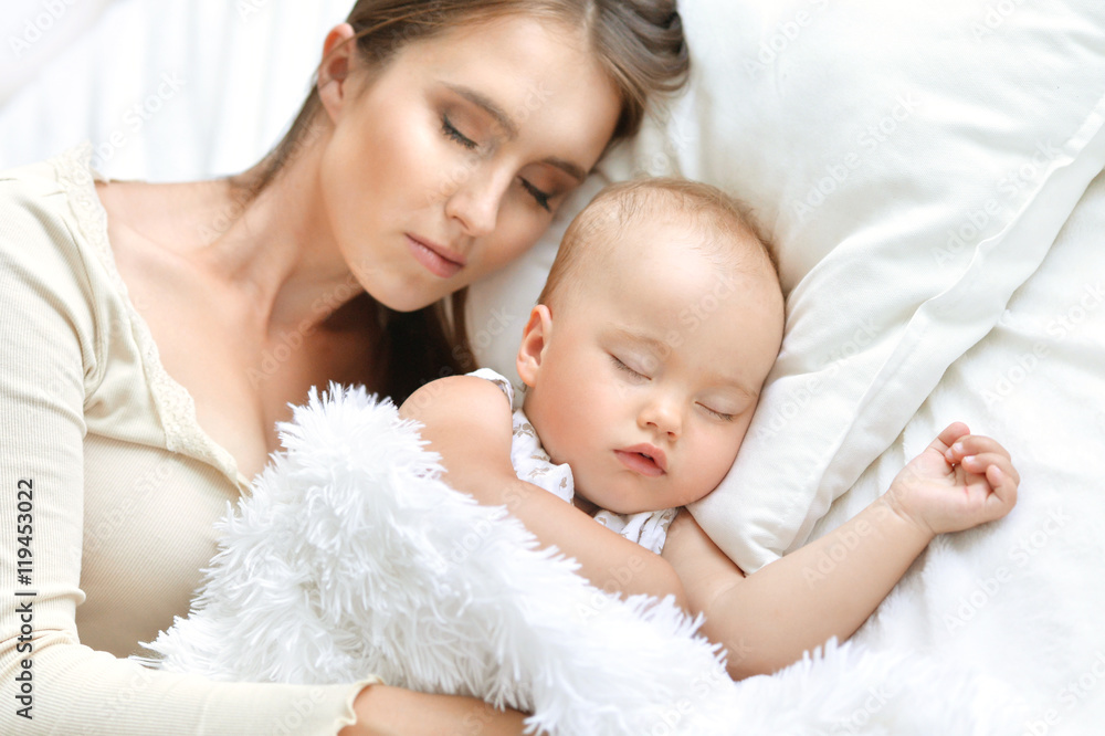 Sleeping mother and child in bed Sleeping mother and child in bed