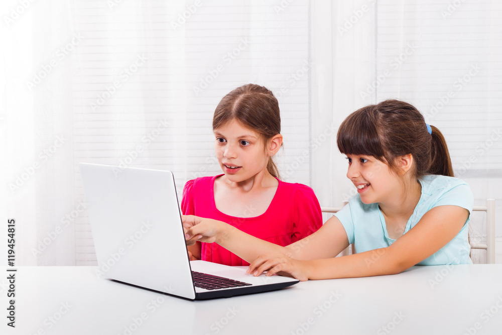 Little girls are using laptop and one little girl is surprised because of something she saw on it.
Little girls are using laptop and one little girl is surprised because of something she saw on it.