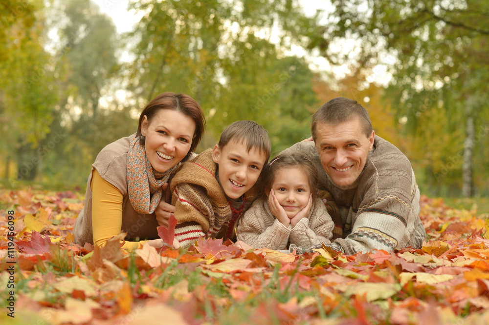 Family relaxing in autumn park Family relaxing in autumn park