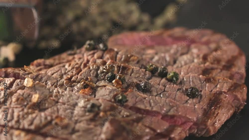 Beef steak on a board with spices. Beef steak on a board with spices.