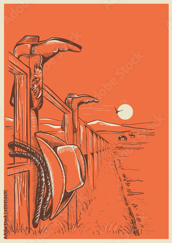 American Ranch landscape with cowboy clothes on fence.
