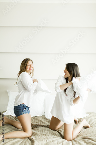 Women having fun on bed