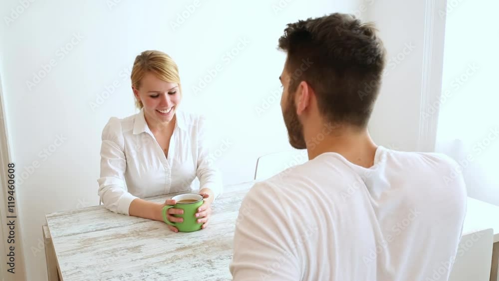 A young couple discussion their financial situation.
A young couple discussion their financial situation.