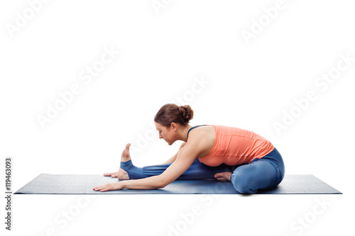 Woman doing Ashtanga Vinyasa Yoga asana Janu sirsasana