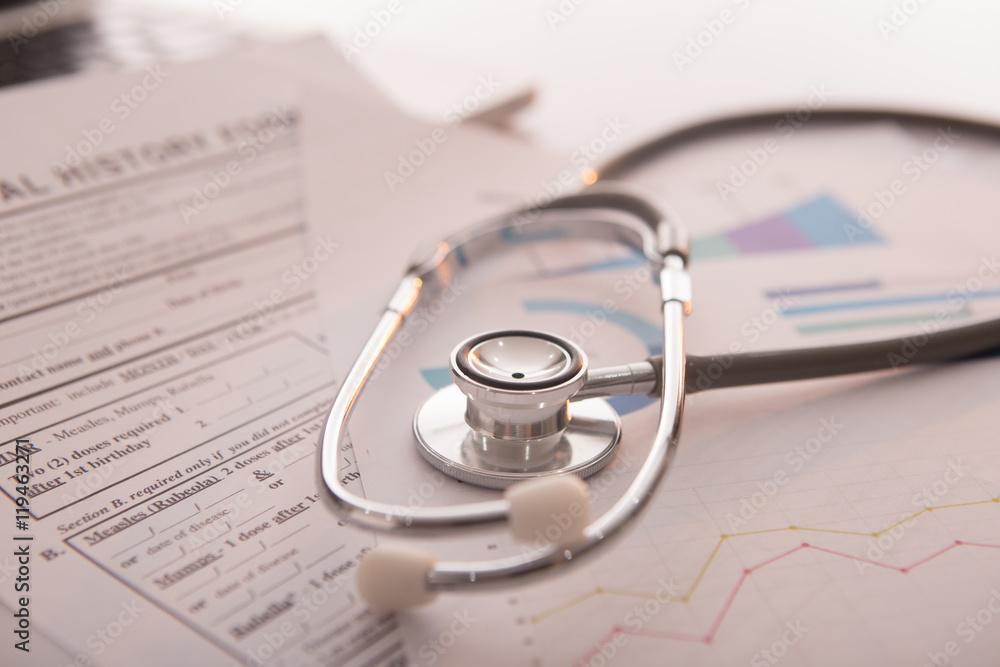 Medical concept with stethoscope on medical history form Medical concept with stethoscope on medical history form