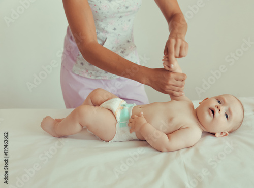 Specialist doing massage a small child.