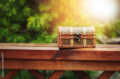 Closed wooden chest box outdoors in nature