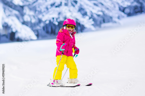 Little girl skiing in the mountains