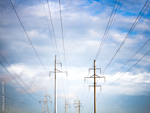 Power line on background of blue sky