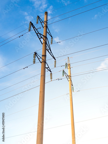Power line on background of blue sky