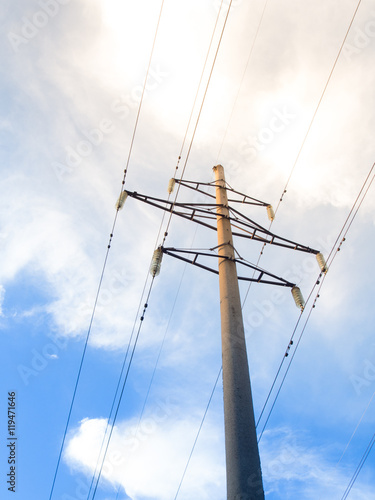 Power line on background of blue sky
