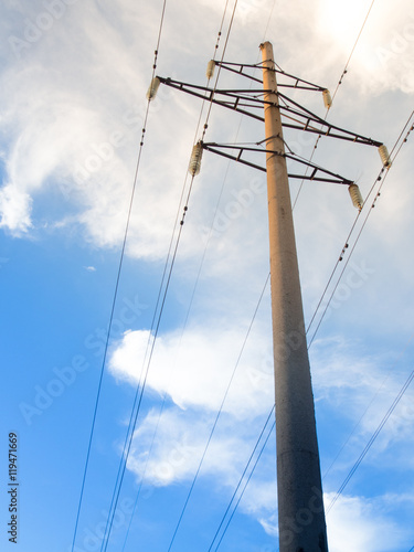 Power line on background of blue sky
