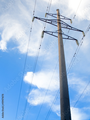 Power line on background of blue sky