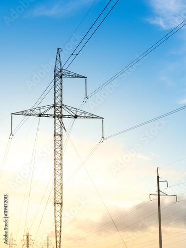 Power line on background of blue sky