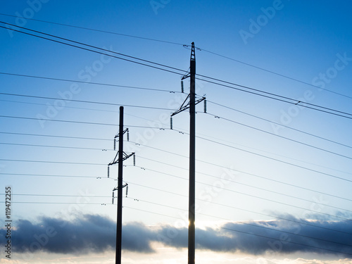 Power line on background of blue sky