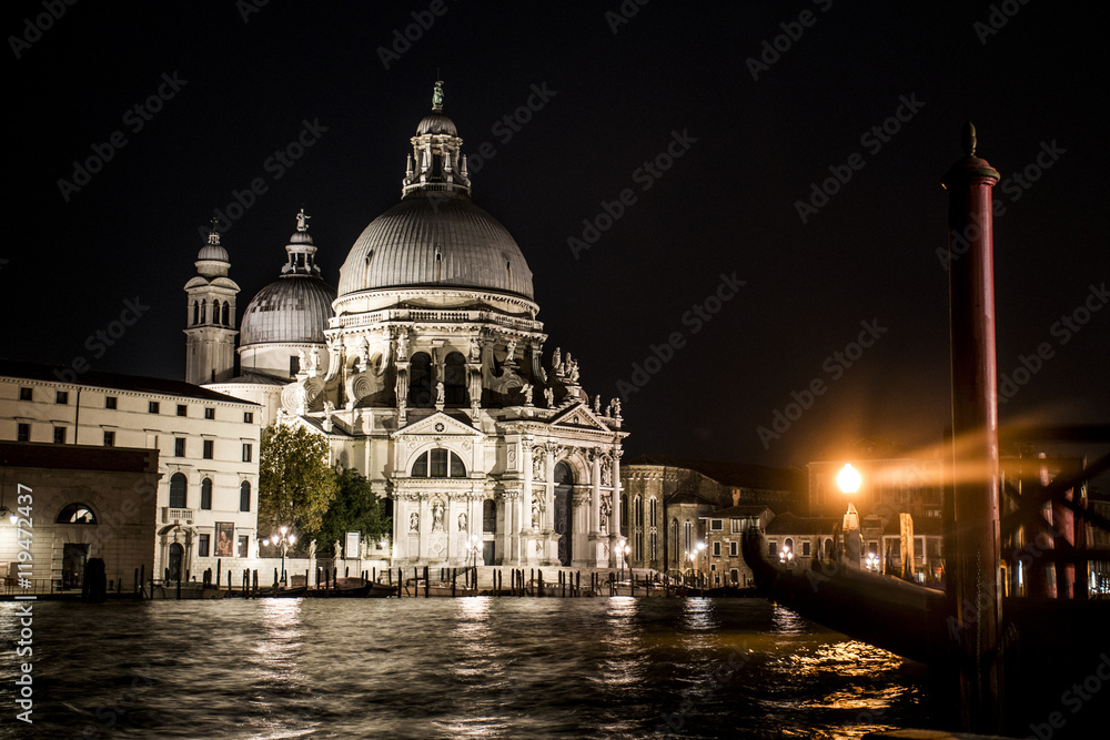 The big canal gondola and boats in romantic Venice in Italy by night