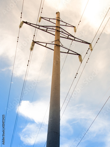 Power line on background of blue sky