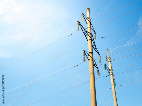 Power line on background of blue sky