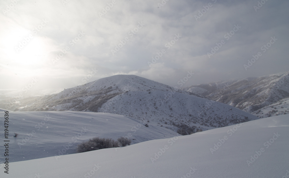 dawn sun in the snowy mountains of Kazakhstan dawn sun in the snowy mountains of Kazakhstan