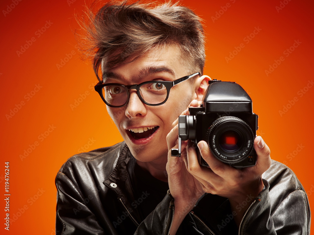 Emotional portrait of a teenager with film camera Emotional portrait of a teenager with film camera
