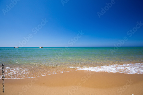 Turquoise crystal clear water. Long sandy beach between Eraclea Minoa and Torre Salsa, Sicily, Italy photo