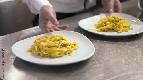 Pasta with peas ready to be served in a restaurant.