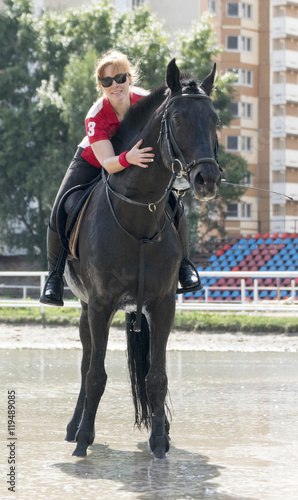 Girl riding a horse © Sergey Kovalev