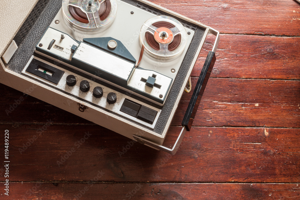 Old tape recorder on wooden background StockFoto Adobe Stock