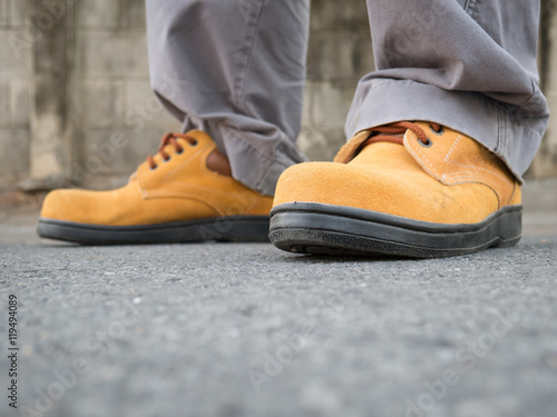 Man wearing safety shoes brown color