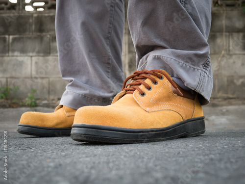 Man wearing safety shoes brown color