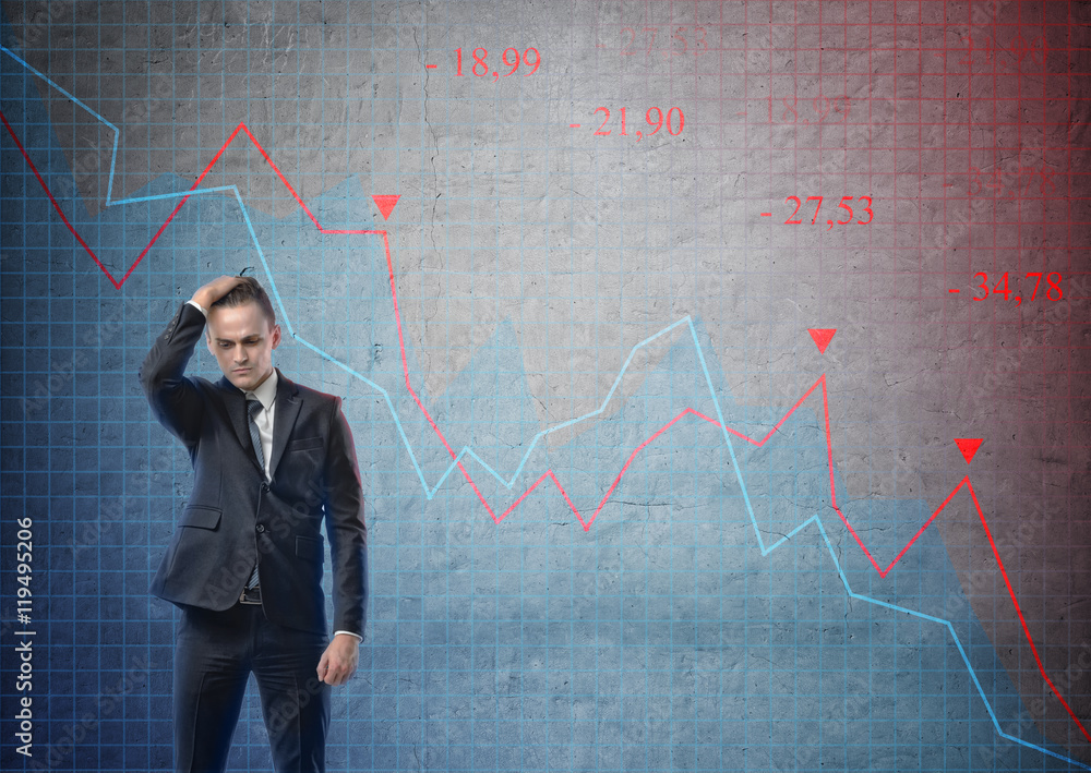 Businessman looking puzzled on the background of stock market crashing Businessman looking puzzled on the background of stock market crashing