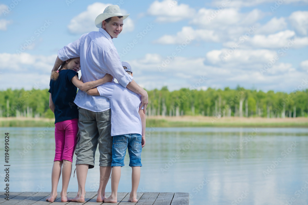 father with children came to rest on the lake