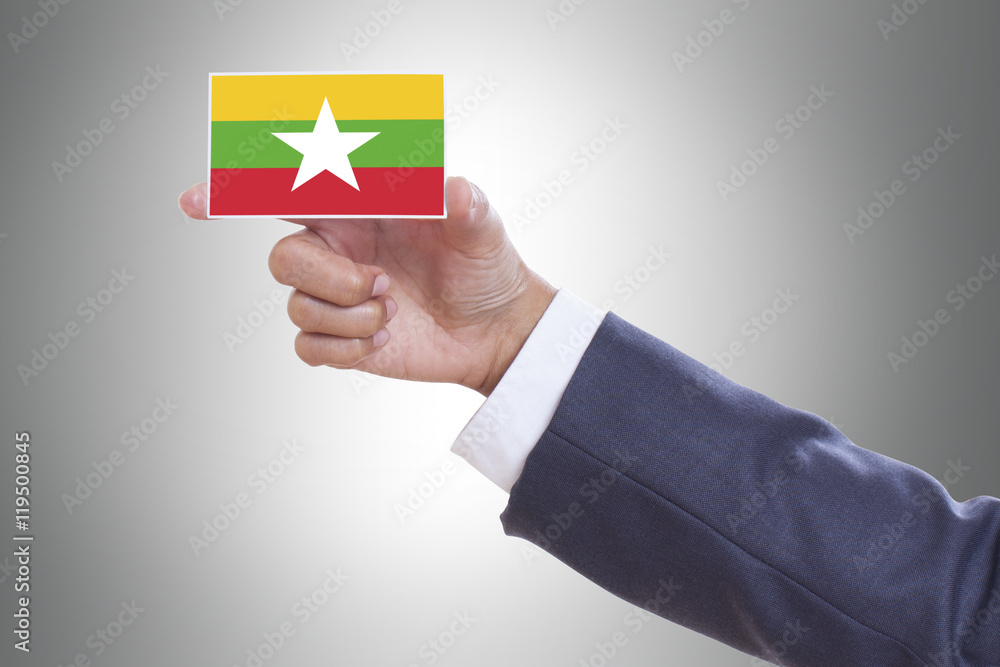 Businessman in suit holding a business card with Burma Flag Businessman in suit holding a business card with Burma Flag