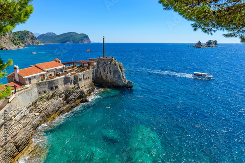 View of the rocky cape in the resort town of Petrovac. photo