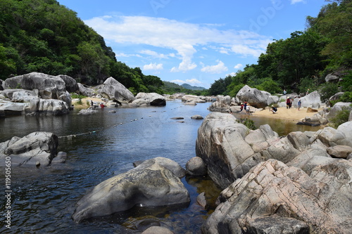 fresh Ham Ho stream with rock reflect on water surface in Binh Dinh province, vietnam
