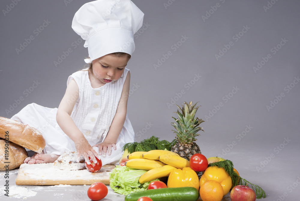 Portrait of Little Caucasian Girl Posing as Cook with Vegetables. Portrait of Little Caucasian Girl Posing as Cook with Vegetables.