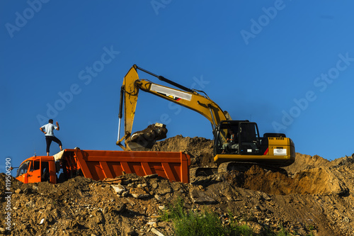 excavator and dump truck skill work